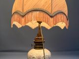 a lamp that is sitting on a table in a room