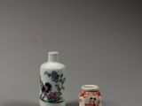 two vases sitting next to each other on a table