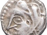 une pièce d'argent sur laquelle figure un visage