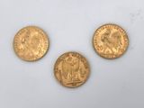 three gold sovereigns, one of which is a sovereign and one of which is a sovereign