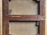 an old picture frame with a hole in the middle of it