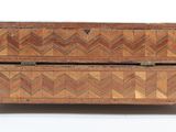 a small wooden box with a lid on a white surface