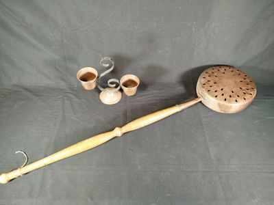 a wooden pipe and a bamboo stick on a table