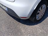 a picture of a white car parked in a parking lot