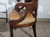 two chairs sitting next to each other on a tiled floor