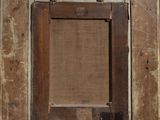 an old wooden frame with a square window in the middle of it