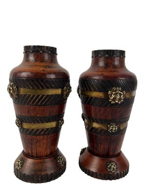 pair of decorative wooden vases with gold accents on a white background
