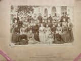 an old photo of a group of people posing for a picture