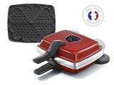 une photo d'un grill électrique rouge équipé d'une plaque de cuisson et d'une poêle