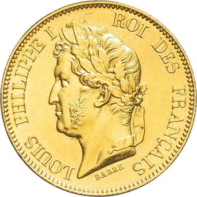 a close up of a gold coin with a woman ' s head on it
