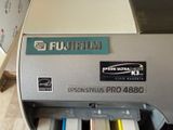 an image of a printer that is sitting on the floor