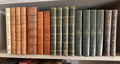 many old books on a shelf in a library