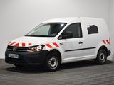 the white van is parked in a room with a checkered floor