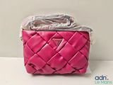 a picture of a pink purse with a plastic bag on top