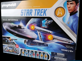 a box with a model of a star trek ship in it