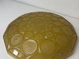 a yellow plate sitting on top of a white counter