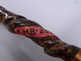 a close up of a wooden stick with a number on it