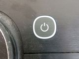 an image of a close up of a button on a coffee maker
