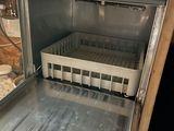 a silver oven with a tray of food inside of it