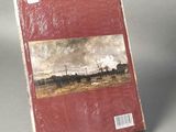 a red book with a picture of a train on it