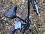 a bicycle that is parked in the dirt