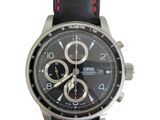 men ' s watch with black dial and red stitching on a black leather strap