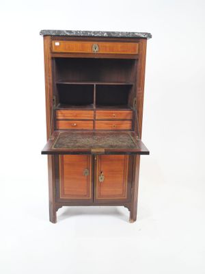 an old wooden cabinet with a marble top and drawers