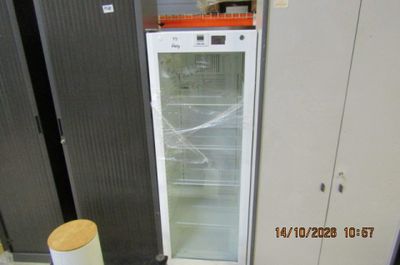 an image of a refrigerator in a store with its door open