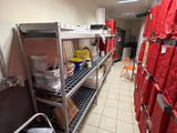 a room filled with lots of red bags and boxes
