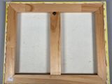 a close up of a picture of a picture frame on a wall