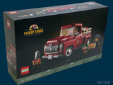 a box with a toy truck in it on a blue background