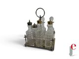 a silver and glass bottle set with a keychain