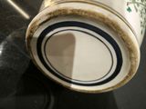 a close up of a vase on a table