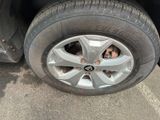 a close up of a car tire with a hole in the tire