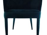 a dark blue velvet chair with a curved back and legs