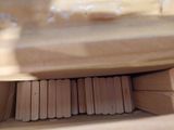 a close up picture of a wooden block on a table