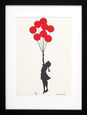 a black and white picture of a girl holding red balloons