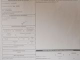 a sheet of paper on a table with a calculator on it