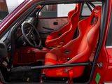 a red car with red seats in the back of it