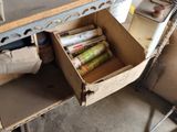 a box full of books sitting on a workbench