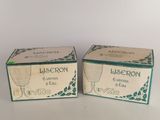 two boxes of lissonn eye creams sitting on a table