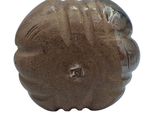 a brown vase that is sitting on a white surface