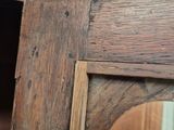 a wooden table with a mirror on top of it