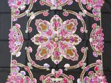 black silk scarf with pink and gold floral design