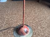 a lamp that is on a stand on the floor