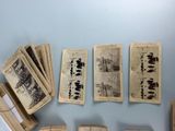 many old books on a table with a blue background