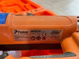 a stapler that is sitting on top of an orange box