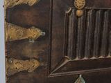 a wooden box with a metal latch on it