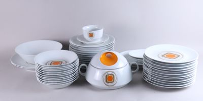 a lot of plates and cups on the table