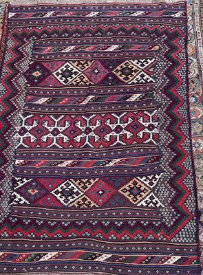 an oriental rug with a red and blue design on it